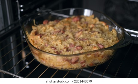 Baked pasta in the oven, pasta with cheese sauce, egg pasta, baked oven pasta with ham and crust - Shutterstock ID 2201448879