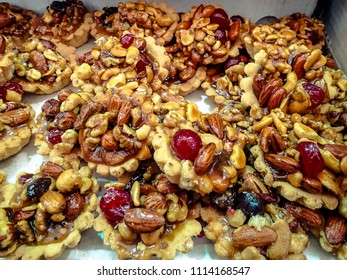 Baked pastry with fruit and nuts.  Healthy treat for breakfast or tea