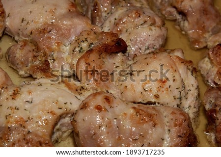 A baked piece of meat, chicken. Hot dish. Food for meat lovers.