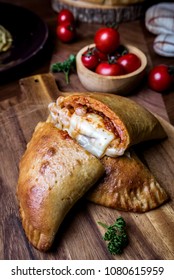 Baked Pizza Puff Set On Dinner Table.