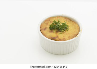 Baked Pot Pie With Crispy Mashed Potato Top And Parsley Garnish.  Isolated On White Background.