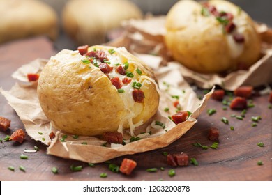 Baked Potato With Cheese And Bacon. Close Up