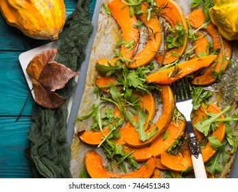 Baked Pumpkin Slices With Arugula On Baking Tray. Fall Food