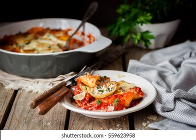Baked Ricotta and Spinach Stuffed Conchiglioni with Tomato Sauce, copy space for your text