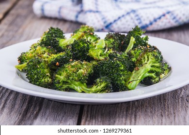 Baked Roasted Garlic Parmesan And Olive Oil Broccoli Side Dish On Wooden Table