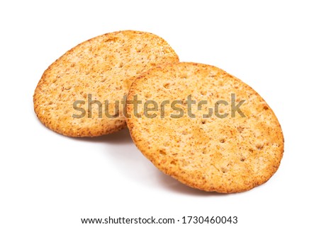 Baked round cracker chips isolated on white background. Wheat cracker chips isolated on white background. Whole wheat cracker isolated on white background with clipping path