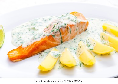 Baked Salmon With Creamy Dill Sauce And Potatoes