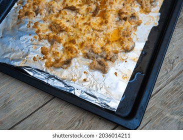 Baked Salmon Fillet On A Baking Sheet. Wooden Background.