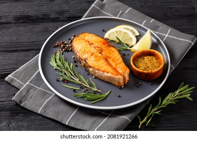 Baked Salmon Steak With Wholegrain Mustard, Lemon, Rosemary On A Plate, Horizontal View From Above