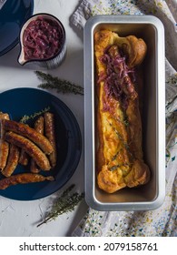 Baked Sausages With Yorkshire Pudding Batter Served With Onion Gravy, Toad In The Hole