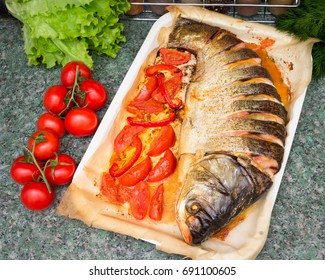 Baked Silver Carp With Tomatoes.