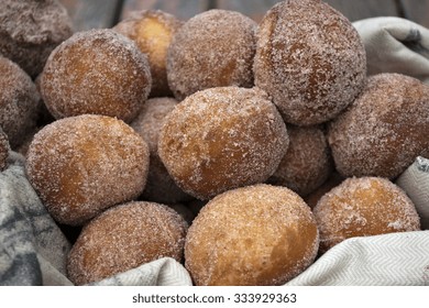 Baked Snickerdoodle Donut Holes Coated With Sugar And Cinnamon In A Basket.