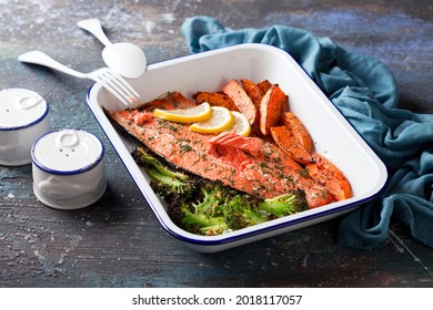 Baked Sockeye Salmon Fish Fillet With Roasted Sweet Potato And Broccoli, In Enameled Baking Dish, Selective Focus