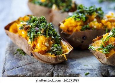 Baked Sweet Potato With Crispy Kale, Walnuts And Feta Cheese