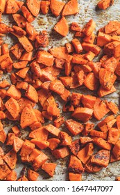 Baked Sweet Potato On A Baking Sheet. Vegan Food Concept.