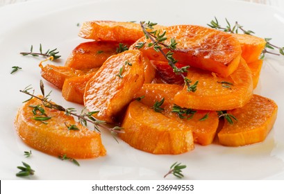 Baked Sweet Potato Wedges On  White Plate. Selective Focus