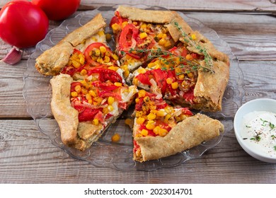 Baked Tomato Corn Galette Wooden Background