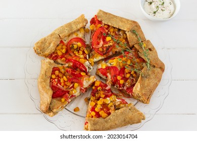 Baked Tomato Corn Galette Wooden Background