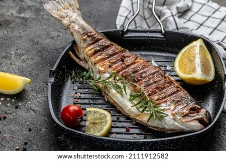 Baked trout fish, Grilled trout barbeque with lemon, Healthy eating concept. banner, menu, recipe place for text, top view,