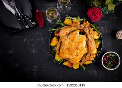 Baked Turkey Or Chicken. The Christmas Table Is Served With A Turkey, Decorated With Bright Tinsel. Fried Chicken. Table Setting. Christmas Dinner. Top View