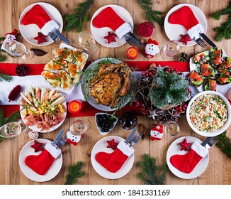 Baked Turkey. Christmas Dinner. The Christmas Table Is Served With A Turkey, Decorated With Bright Tinsel And Candles. Fried Chicken, Table.  Family Dinner. Top View, Flat Lay, Overhead, Copy Space