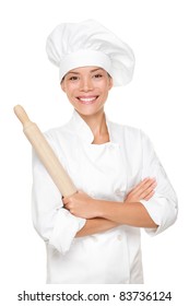 Baker / Chef Woman Smiling Happy Holding Baking Rolling Pin Wearing Uniform Isolated On White Background. Beautiful Young Mixed Race Asian Caucasian Female Model With Arms Crossed Standing Proud