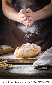 Baker Cooking Bread. Man Slaps Flour Over The Dough. Man's Hands Making Bread