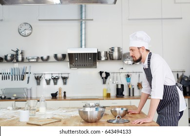 Baker Following Recipe Points While Making Dough