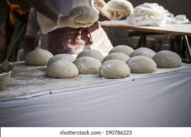 Baker Making Artisan Bread In A Medieval Fair