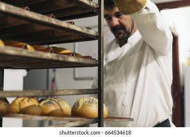 Baker making bread at a bakery. Bakery Concept.