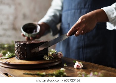 Baker Man Using Spatula Making Chocolate Cake