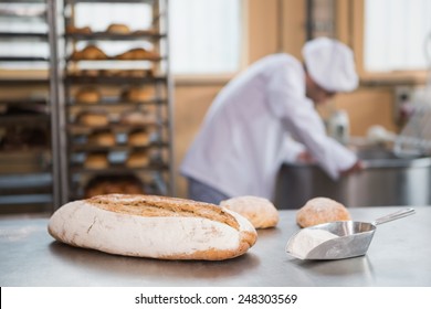 Baker Preparing Dough In Industrial Mixer At The Bakery