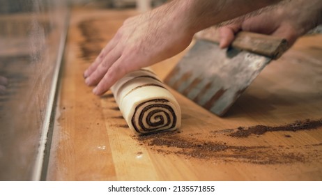 Baker Working With Handmade Pastries In Small Bakery. Cocoa Snail Roll, Chocolate Roll. Closeup Photo Of Not Staged, Authentic Moment.