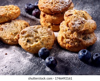Bakers gonna bake. Serving food on slate. Oatmeal cookies biscuit with blueberry on dark tiles countrylike. Chocolate chip cookies shop on window display. Lunch in inexpensive cafe. - Shutterstock ID 1746492161