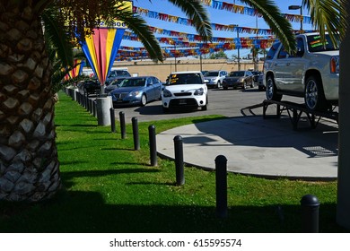 BAKERSFIELD, CA - APRIL 4, 2017: This well-maintained used car lot is quiet on a sunny weekday morning. Business has been slow lately.