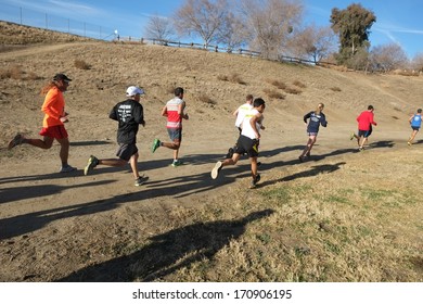 BAKERSFIELD, CA - JAN 11, 2014: The ten kilometer race contestants are sprinting off to a fast start at the 24th Annual Fog Run, although there is only abundant sunshine this year.