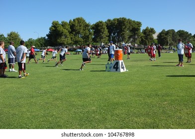 BAKERSFIELD, CA - JUNE 9: Boys Sprint To Get In Shape For The Golden Empire Youth Football Camp At Bakersfield Community College On June 9, 2012,  In Bakersfield, California.