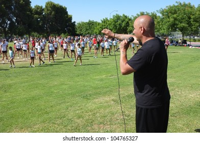 BAKERSFIELD, CA - JUNE 9: Dak Eubanks Leads Girls Through Routine At The Golden Empire Cheerleader Camp, Bakersfield Community College, On June 9, 2012,  In Bakersfield, California