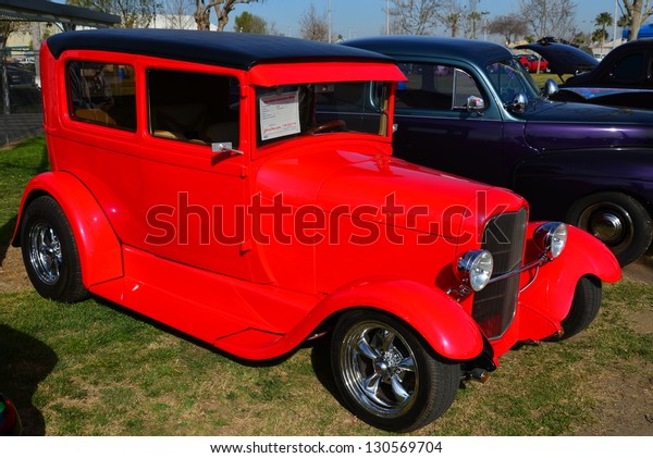 BAKERSFIELD,\
CA-MAR 2: A very red custom 1929 Ford Model A makes a bold\
statement at the Cruisin\' For A Wish Car & Motorcycle Show on\
March 2, 2013, in Bakersfield,\
California
