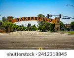 Bakersfield welcome sign over the road on a clear day. Also known as the Bakersfield Neon Arch, it is one of the most recognizable landmarks in Bakersfield, California.