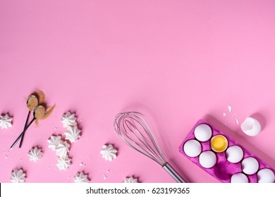 Bakery Background Frame. Cooking Ingredients - Egg, Sugar, Over Pink Background. Spring Cooking Theme. Top View, Copy Space.