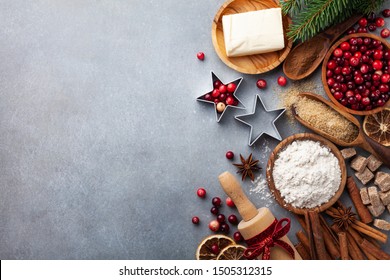 Bakery Background With Ingredients For Cooking Christmas Baking. Flour, Brown Sugar, Butter, Cranberry And Spices On Table Top View.