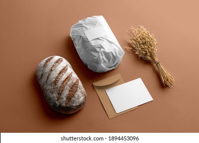 Bakery Branding Mockup, Wrapped In Paper Bread, Wheat, Empty Space To Display Your Logo Or Design.