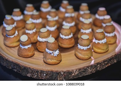 Bakery bread with cream and sugar design in snowman shape on wooden tray prepare for service in party event dessert food bar - Powered by Shutterstock