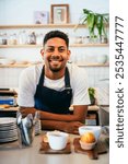 Bakery, happy portrait of hispanic black man in cafe ready for serving pastry, coffee and baked foods. Restaurant, coffee shop and confident waiter barista by counter for service, help and welcome