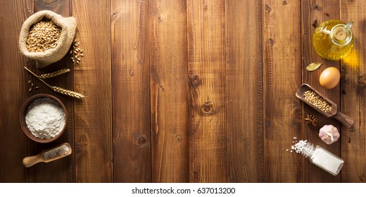 Bakery Ingredients On Wooden Plank Background