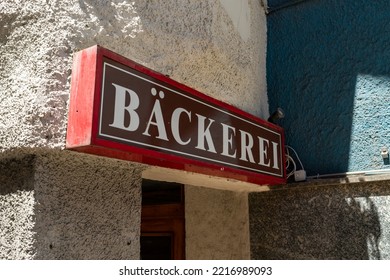 Bakery Lettering On A Building Exterior. Advertising Of A Small Business In A Town. The Big Sign On A Wall Leads To The Entrance. The Local Store Sells Baked Goods And Pastries.