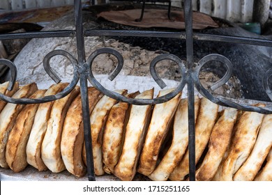 Bakery With Primitive Oven And Bread.