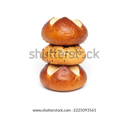 Bakery product assortment kaiser roll bun with linseeds and sesame seeds, traditional German laugenbrot, Bavarian homemade pretzel rolls lye bread isolated on a white background.