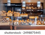 Bakery shop with assortment of bread on shelves. High quality photo